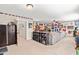 Expansive recreation room with entertainment area, sectional sofa, natural light, and decor at 50 Lockamy Ln, Youngsville, NC 27596