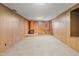 Finished basement with wood paneling and a unique fireplace, perfect for entertaining at 501 Orange High School Rd, Hillsborough, NC 27278