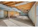 Spacious unfinished basement with exposed wood and block walls, offering ample potential at 501 Orange High School Rd, Hillsborough, NC 27278