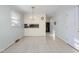 Bright dining area with tile flooring and an elegant chandelier at 501 Orange High School Rd, Hillsborough, NC 27278