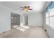 Bright, carpeted living room with connecting rooms, multiple closets and storage at 501 Orange High School Rd, Hillsborough, NC 27278