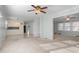 Open-concept living and dining area featuring carpet and tile floors, creating a welcoming space at 501 Orange High School Rd, Hillsborough, NC 27278
