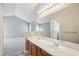 Bright bathroom featuring a double vanity, updated lighting, and a large mirror at 509 High Ridge Dr, Durham, NC 27707