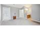 Spacious bedroom featuring an ensuite bathroom, carpet flooring, and a private exterior door at 509 High Ridge Dr, Durham, NC 27707