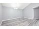 Bright dining area with a modern chandelier and gray flooring at 509 High Ridge Dr, Durham, NC 27707
