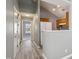 Hallway leading to other rooms of the house showcasing neutral gray walls and light gray flooring at 509 High Ridge Dr, Durham, NC 27707
