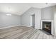 Inviting living room with a fireplace and modern gray flooring at 509 High Ridge Dr, Durham, NC 27707