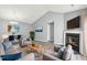 Open-concept living room featuring a fireplace, vaulted ceiling, and contemporary decor at 509 High Ridge Dr, Durham, NC 27707
