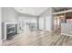 Bright living area with fireplace, sliding door to patio, and neutral gray walls at 509 High Ridge Dr, Durham, NC 27707