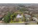 Sprawling property with a well-maintained home featuring a circular driveway and mature landscaping at 513 N Nash St, Hillsborough, NC 27278