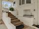 Inviting back porch with brick stairs, outdoor sink and brick accents at 513 N Nash St, Hillsborough, NC 27278