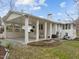 The home features a spacious covered carport, providing shade and shelter, as well as an additional outdoor living space at 513 N Nash St, Hillsborough, NC 27278