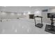 Spacious basement with white painted brick fireplace and exercise equipment at 513 N Nash St, Hillsborough, NC 27278