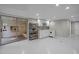 Basement kitchenette with white cabinetry, pantry and view of brick structure at 513 N Nash St, Hillsborough, NC 27278