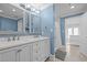 Bright bathroom featuring double vanity, tile floors and a glass shower at 513 N Nash St, Hillsborough, NC 27278