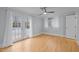 Bedroom with beautiful hardwood floors, ceiling fan and access to the outdoors at 513 N Nash St, Hillsborough, NC 27278