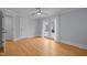 Bedroom with beautiful hardwood floors, ceiling fan and access to the outdoors at 513 N Nash St, Hillsborough, NC 27278