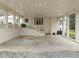 Spacious brick carport featuring recessed lighting, brick columns and a full length bay window at 513 N Nash St, Hillsborough, NC 27278