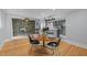 Dining area with modern table and chairs, next to updated kitchen at 513 N Nash St, Hillsborough, NC 27278