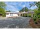 A brick patio connects to the main house with a wide-open view of the backyard at 513 N Nash St, Hillsborough, NC 27278