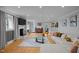 Inviting living room featuring hardwood floors, a fireplace, and comfortable seating at 513 N Nash St, Hillsborough, NC 27278
