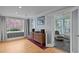 Cozy living room with hardwood floors and view to sunroom at 513 N Nash St, Hillsborough, NC 27278