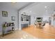 Open concept living space with bar, kitchen, and living areas at 513 N Nash St, Hillsborough, NC 27278