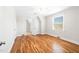 Bright bedroom with hardwood floors, white trim, a ceiling fan, and natural light at 518 Parkview Dr, Burlington, NC 27215