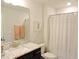 Cozy bathroom featuring a granite-topped vanity and a shower with a white curtain at 519 Flat Ford Rd, Hillsborough, NC 27278