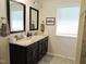 Bathroom showcases a double sink vanity, granite countertops, and framed mirrors above each sink at 519 Flat Ford Rd, Hillsborough, NC 27278
