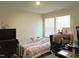 This bedroom offers a comfortable space with bright natural lighting and versatile layout options at 519 Flat Ford Rd, Hillsborough, NC 27278