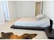 Large bedroom with a platform bed and minimal decor allows for customization and personalization at 519 Flat Ford Rd, Hillsborough, NC 27278