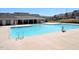 Sparkling community pool with clean, blue water, surrounded by a spacious concrete deck and neighborhood homes at 519 Flat Ford Rd, Hillsborough, NC 27278