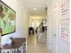 Bright entryway featuring a staircase and light colored flooring with a view into the living room at 519 Flat Ford Rd, Hillsborough, NC 27278