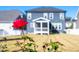 Backyard view with red rose in the foreground showcasing the home's exterior at 52 N Rosebank Dr, Chapel Hill, NC 27516