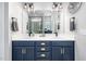 The bathroom has a double vanity, large mirror, and shower in the background at 52 N Rosebank Dr, Chapel Hill, NC 27516