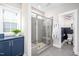 Modern bathroom with a glass shower and dark blue cabinetry at 52 N Rosebank Dr, Chapel Hill, NC 27516