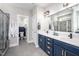Bathroom featuring double sinks with white marble counters at 52 N Rosebank Dr, Chapel Hill, NC 27516