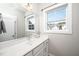 Bright, clean bathroom with white marble counters, neutral colors, and a large mirror at 52 N Rosebank Dr, Chapel Hill, NC 27516