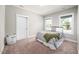 Neutral bedroom with carpet, large windows and lots of light at 52 N Rosebank Dr, Chapel Hill, NC 27516