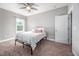 This bedroom has neutral paint, a ceiling fan and a window at 52 N Rosebank Dr, Chapel Hill, NC 27516