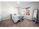 Bright bedroom featuring natural light from the window and a full-length mirror at 52 N Rosebank Dr, Chapel Hill, NC 27516