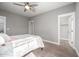 Neutral bedroom with ceiling fan and walk-in closet at 52 N Rosebank Dr, Chapel Hill, NC 27516