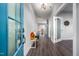 Bright foyer with hardwood floors and a bench with decorative cushions at 52 N Rosebank Dr, Chapel Hill, NC 27516