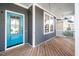 Inviting front porch with a vibrant blue door and a cozy seating area at 52 N Rosebank Dr, Chapel Hill, NC 27516