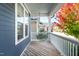 Spacious front porch featuring a wooden deck with views of the neighborhood at 52 N Rosebank Dr, Chapel Hill, NC 27516