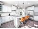 Elegant kitchen with white cabinetry, granite countertops, and modern appliances at 52 N Rosebank Dr, Chapel Hill, NC 27516