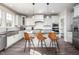 Gourmet kitchen featuring an island with seating and modern pendant lighting at 52 N Rosebank Dr, Chapel Hill, NC 27516