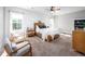 Bright and airy primary bedroom with white plank walls, ceiling fan and natural light at 52 N Rosebank Dr, Chapel Hill, NC 27516