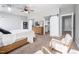 This main bedroom has a ceiling fan, sliding closet doors, and decor at 52 N Rosebank Dr, Chapel Hill, NC 27516